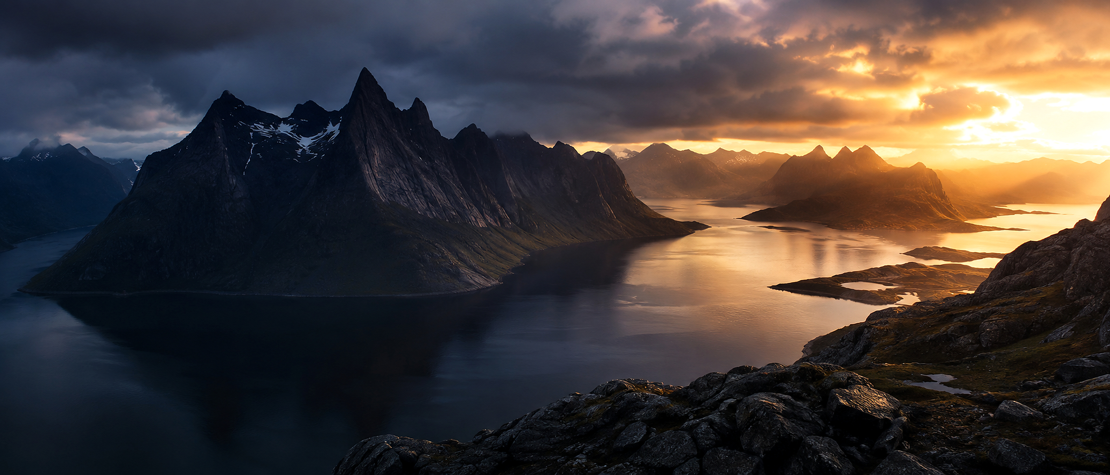 Dramatic Nordic fjord at sunset, full-width homepage hero